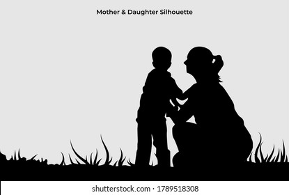 Mother holding the child silhouette. Love symbol of family on black color. Eps 10. Holiday background element.