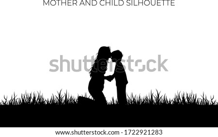 Mother kiss the forehead of the child silhouette. Love symbol of family on black color. Eps 10. Holiday background element.