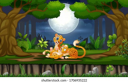 Mother leopard with her cub playing at night