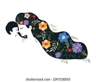 mother lifting son with floral pattern in the hair