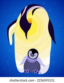 Mother penguin protecting her little baby penguin from cold