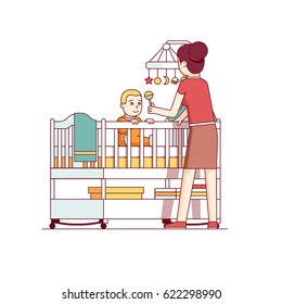 Mother playing with her little baby son sitting in crib bed or cot. Woman looking after newborn boy. Mum and child in kids room. Flat style cartoon vector illustration isolated on white background.