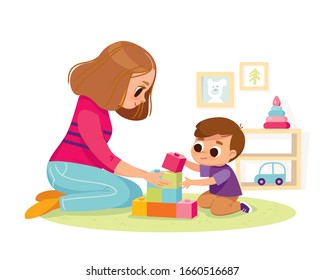 Mother playing with kid at home. Educational toys. Child playing designer cubes, developmental constructor. 