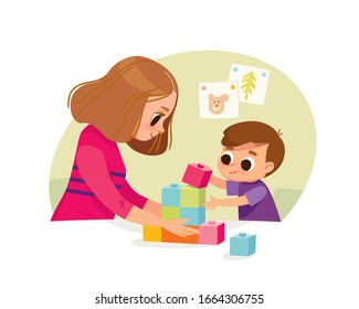 Mother playing with kid at home. Educational toys. Child playing designer cubes, developmental constructor.