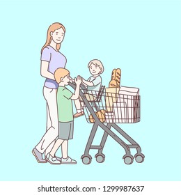 Mother pushing full shopping cart with her children, walking boy and girl sitting inside trolley. Smiling happy family. Mom & kids, son, daughter groceries shopping together. Flat line illustration