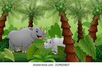 A mother rhino with cubs playing in the palm jungle