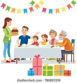 Mother Serves Birthday Cake At Family Meal