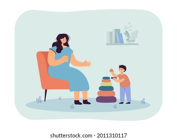 Mother sitting on chair, helping her son assemble pyramid. Mom and kid playing and spending time together flat vector illustration. Parenthood concept for banner, website design or landing web page