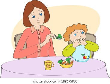 Mother spoon-feeds the child, but child does not want to eat