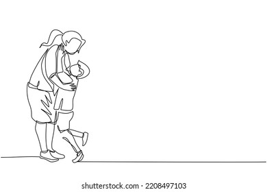 a mother stands hugging her son a boy is hugged by his mother. a grown woman with pigtails. a career woman comes home from work hugging her son. the happiness of a child is loved by his mother