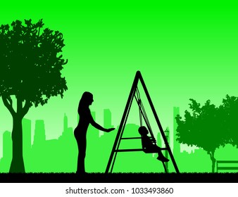 Mother swinging child on a swing in the park, one in the series of similar images silhouette