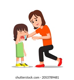 A mother tries to calm her crying daughter