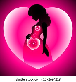 Mother's day, beautiful pregnant woman silhouette inside a glowing heart