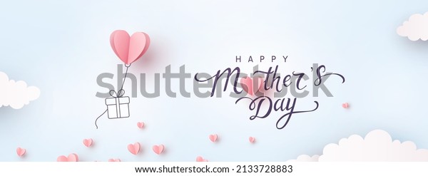 Mother\'s day postcard with paper flying\
elements and gift box on blue sky background. Vector symbols of\
love in shape of heart for greeting card\
design