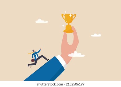 Motivation to achieve goal, small win to motivate employee to succeed in work, effort and ambition to reach target concept, businessman run with full effort to reach trophy cup in giant hand.