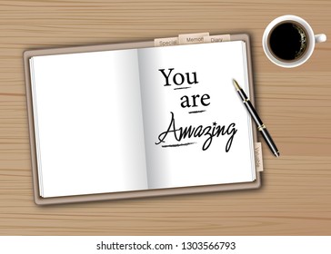 Motivation quote in Diary book on wooden table.