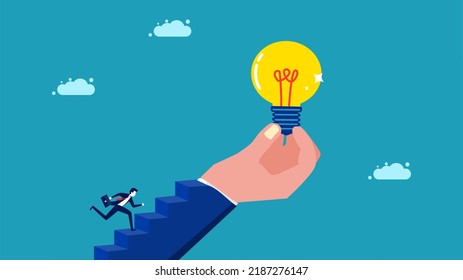 Motivation for success. a businessman running up the stairs with a hand holding a light bulb