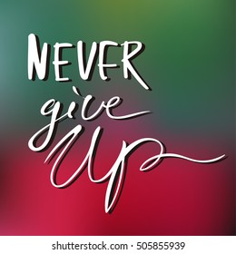  Motivational lifestyle phrase calligraphy on blurry background.   Never give up.                           