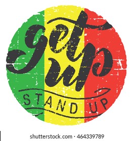 Motivational quote ''Get up, stand up''. Grunge texture. Reggae flag round background. Hand lettering calligraphic typography. Usable for t-shirts, posters, stickers...