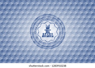 motivational speech icon inside blue polygonal badge.