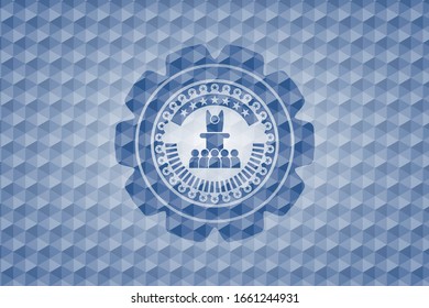 motivational speech icon inside blue badge with geometric pattern.