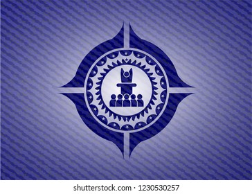 motivational speech icon inside emblem with denim texture
