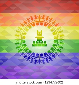 motivational speech icon inside emblem on mosaic background with the colors of the LGBT flag
