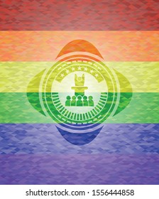 motivational speech icon inside emblem on mosaic background with the colors of the LGBT flag