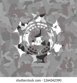 motivational speech icon inside grey camouflage emblem