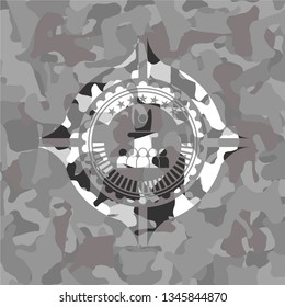 motivational speech icon inside grey camouflage texture