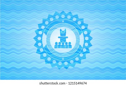 motivational speech icon inside light blue water wave style badge.