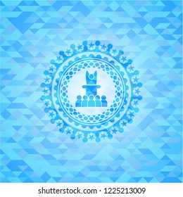 motivational speech icon inside light blue emblem with triangle mosaic background
