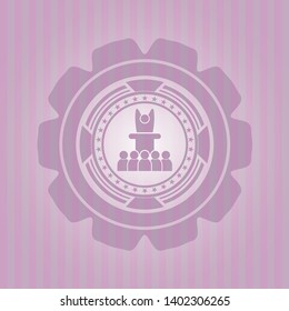 motivational speech icon inside pink emblem