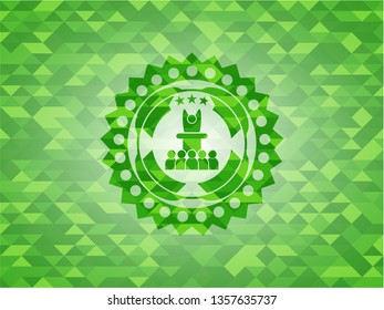 motivational speech icon inside realistic green mosaic emblem