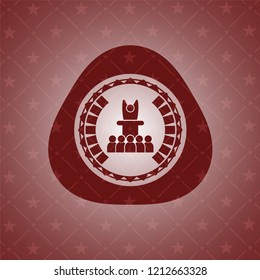 motivational speech icon inside red emblem