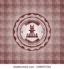 motivational speech icon inside red seamless badge with geometric pattern.