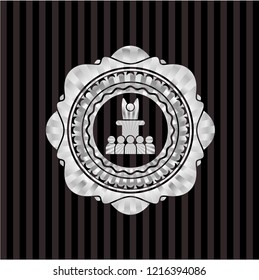motivational speech icon inside silver emblem or badge