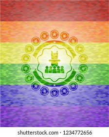 motivational speech icon on mosaic background with the colors of the LGBT flag