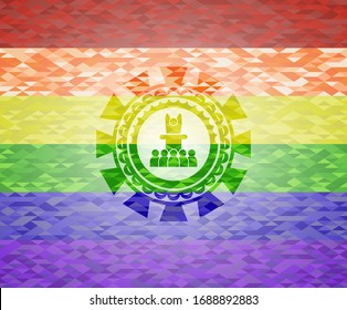 motivational speech icon on mosaic background with the colors of the LGBT flag