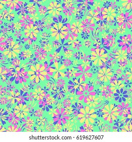 Motley seamless background with a pattern of a variety of small flowers for spring or summer design