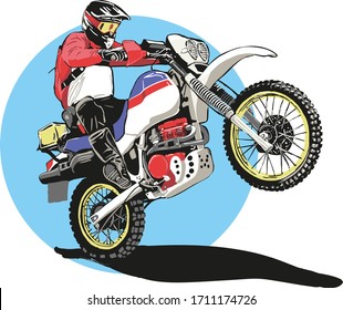 The motorcycle driver got on the rear wheel. Off-road and adventure bike, motorcycling, motocross race. Hobbies and active lifestyle. Biker on the bike.