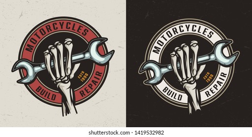 Motorcycle repair shop round colorful emblem with skeleton hand holding wrench in vintage style isolated vector illustration