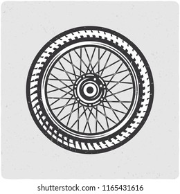 Motorcycle wheel. Black and white illustration. Isolated on light backgrond with grunge noise and frame.