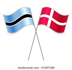Motswana and Danish crossed flags. Botswana combined with Denmark isolated on white. Language learning, international business or travel concept.