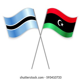 Motswana and Libyan crossed flags. Botswana combined with Libya isolated on white. Language learning, international business or travel concept.