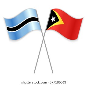 Motswana and Timorese crossed flags. Botswana combined with East Timor isolated on white. Language learning, international business or travel concept.