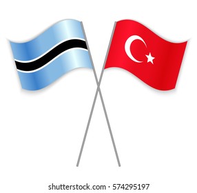 Motswana and Turkish crossed flags. Botswana combined with Turkey isolated on white. Language learning, international business or travel concept.