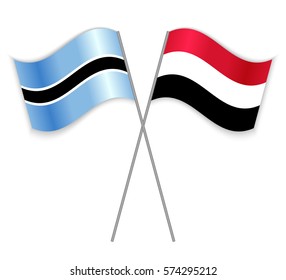 Motswana and Yemeni crossed flags. Botswana combined with Yemen isolated on white. Language learning, international business or travel concept.