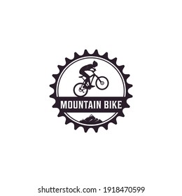 Mountain bike logo complete with illustration of a cyclist riding a bicycle with gusto