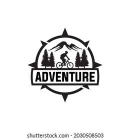 Mountain biker with compass border. Adventure logo vector.